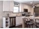 Modern kitchen featuring white cabinets, stainless steel appliances, a dishwasher, and wood-look floors at 934 Tiger Loop, Saint Stephen, SC 29479