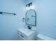 Bathroom with modern vanity, round mirror, and matte black hardware at 1005 Trotters Blvd, Summerville, SC 29483