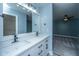 Bright bathroom with double sinks, modern fixtures, and a view into the bedroom at 1005 Trotters Blvd, Summerville, SC 29483