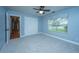 Comfortable bedroom with neutral carpet, a window with a valance, and ample closet space at 1005 Trotters Blvd, Summerville, SC 29483