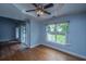 Bedroom with hardwood floors, large window and sliding glass doors to outdoor space at 1005 Trotters Blvd, Summerville, SC 29483