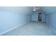 Spacious bedroom with neutral carpet, ceiling fan, and access to an additional room at 1005 Trotters Blvd, Summerville, SC 29483