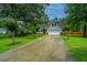 Charming two-story home with landscaped yard, long driveway and attached two car garage at 1005 Trotters Blvd, Summerville, SC 29483