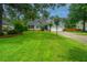 Charming two-story home with landscaped yard, driveway and attached two car garage at 1005 Trotters Blvd, Summerville, SC 29483