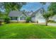 Charming two-story home with landscaped yard, driveway and attached two car garage at 1005 Trotters Blvd, Summerville, SC 29483