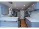Updated kitchen with breakfast bar, pendant lighting, stainless steel appliances and tile backsplash at 1005 Trotters Blvd, Summerville, SC 29483