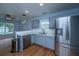 Spacious kitchen boasts stainless steel refrigerator and ample countertop space for meal preparation at 1005 Trotters Blvd, Summerville, SC 29483