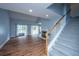 Cozy living room with fireplace, staircase and natural light from sliding doors at 1005 Trotters Blvd, Summerville, SC 29483