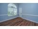 Bright room with sleek wooden floor and modern arched window is an ideal space for relaxation at 1005 Trotters Blvd, Summerville, SC 29483