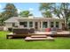 Well-maintained backyard featuring a large deck with seating, grilling area, and play set at 1015 Jacksnipe Ln, Mount Pleasant, SC 29464