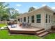 Spacious backyard with a deck, outdoor seating, grilling area, and plenty of green space at 1015 Jacksnipe Ln, Mount Pleasant, SC 29464