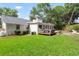 Expansive backyard featuring a deck, outdoor seating, green space and lush landscaping at 1015 Jacksnipe Ln, Mount Pleasant, SC 29464