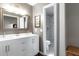 Bathroom with double sink vanity, modern fixtures, and marble tile shower, with gold hardware at 1015 Jacksnipe Ln, Mount Pleasant, SC 29464