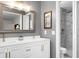 Bathroom featuring a double vanity, quartz countertops, stylish fixtures, and a walk-in marble shower at 1015 Jacksnipe Ln, Mount Pleasant, SC 29464