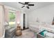 Bright Bedroom features a white crib, soft rug, chair and window with natural light at 1015 Jacksnipe Ln, Mount Pleasant, SC 29464
