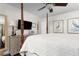 Well-lit bedroom with a four-poster bed, hardwood floors, and neutral decor, with dresser at 1015 Jacksnipe Ln, Mount Pleasant, SC 29464