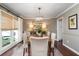 Bright dining room featuring a chandelier, stylish furnishings, and large windows with a view at 1015 Jacksnipe Ln, Mount Pleasant, SC 29464