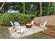 Inviting backyard fire pit area with Adirondack chairs, perfect for outdoor gatherings at 1015 Jacksnipe Ln, Mount Pleasant, SC 29464
