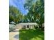 Attractive home with attached garage, nice landscaping, and a boat parked in the driveway at 1015 Jacksnipe Ln, Mount Pleasant, SC 29464