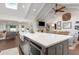 Open-concept kitchen featuring an island with stone countertops and stainless steel appliances at 1015 Jacksnipe Ln, Mount Pleasant, SC 29464
