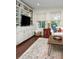 Cozy living room features built-in shelving, a comfortable sectional sofa, and an area rug on hardwood floors at 1015 Jacksnipe Ln, Mount Pleasant, SC 29464