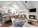 Bright living area featuring an open-concept design and a fireplace with an integrated TV at 1015 Jacksnipe Ln, Mount Pleasant, SC 29464