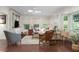 Inviting living room with hardwood floors, a large sectional sofa, and natural light from surrounding windows at 1015 Jacksnipe Ln, Mount Pleasant, SC 29464