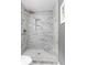 Modern shower stall features marble tile walls, a built-in niche, and a bench seat for ultimate relaxation at 1015 Jacksnipe Ln, Mount Pleasant, SC 29464