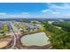 Expansive aerial view of residential homes in the community near forest and pond at 1059 Fitzgerald Ct, Summerville, SC 29485