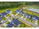 Aerial view of neighborhood homes near a tranquil pond and wooded area at 1059 Fitzgerald Ct, Summerville, SC 29485