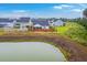 Picturesque backyard of home featuring a fenced-in yard and scenic view of a peaceful pond at 1059 Fitzgerald Ct, Summerville, SC 29485
