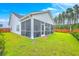 Beautiful backyard featuring a screened porch and lush greenery providing a serene outdoor space at 1059 Fitzgerald Ct, Summerville, SC 29485