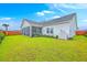 Expansive backyard with a well-maintained lawn, screened porch, and privacy fence, perfect for outdoor enjoyment at 1059 Fitzgerald Ct, Summerville, SC 29485