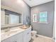 Stylish bathroom with a white vanity, elegant mirror, and nautical decor, perfect for a calming experience at 1059 Fitzgerald Ct, Summerville, SC 29485