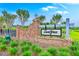 Brick community entrance sign 'Sweetgrass' featuring manicured landscaping, adding to the welcoming neighborhood appeal at 1059 Fitzgerald Ct, Summerville, SC 29485