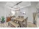 Elegant dining room boasting a rustic wooden table, bench seating, and modern lighting, perfect for gatherings at 1059 Fitzgerald Ct, Summerville, SC 29485