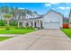 Beautiful home with a spacious driveway, two-car garage, and a welcoming front porch with columns at 1059 Fitzgerald Ct, Summerville, SC 29485