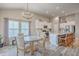 Eat-in kitchen features an island with bar seating, stainless steel appliances, and a dining area at 1059 Fitzgerald Ct, Summerville, SC 29485