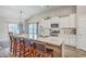 Eat-in kitchen features an island with bar seating, stainless steel appliances, and a dining area at 1059 Fitzgerald Ct, Summerville, SC 29485