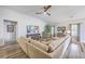 Open-concept living room featuring a large sectional sofa, fireplace, and plenty of natural light, creating a cozy atmosphere at 1059 Fitzgerald Ct, Summerville, SC 29485