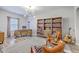 Stylish home office featuring a modern desk, ample bookshelves, and elegant decor for a productive workspace at 1059 Fitzgerald Ct, Summerville, SC 29485