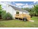Home's backyard featuring a deck with stairs and a built-in grill at 1077 Farmington Rd, Charleston, SC 29412