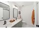 Bright bathroom with double vanity, modern fixtures, and a stylish mirror at 1077 Farmington Rd, Charleston, SC 29412