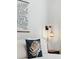 Close up of a cozy bedroom with a decorative pillow and modern lighting at 1077 Farmington Rd, Charleston, SC 29412