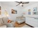 Charming Bedroom with a crib, dresser, artwork, and ceiling fan at 1077 Farmington Rd, Charleston, SC 29412
