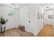 Bright foyer featuring modern wood-look flooring and shiplap walls at 1077 Farmington Rd, Charleston, SC 29412