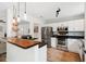A modern kitchen with stainless steel appliances and an open view to the living area at 1077 Farmington Rd, Charleston, SC 29412