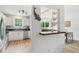 A modern kitchen with stainless steel appliances and a view of the dining and living area at 1077 Farmington Rd, Charleston, SC 29412