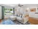 Cozy living room with large windows, comfortable seating, and stylish decor at 1077 Farmington Rd, Charleston, SC 29412