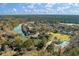 Breathtaking aerial view of community homes along the river and mature trees at 109 Lakeview Dr, Summerville, SC 29485